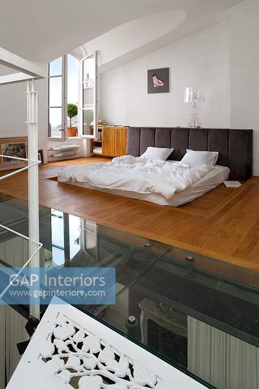 Contemporary bedroom with glass floor