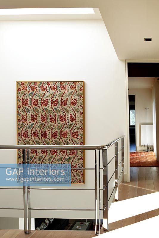 Modern landing with floral tapestry