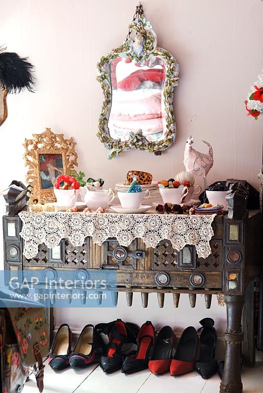 Ornate sideboard with display of vintage items