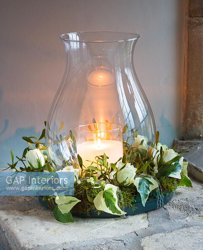Wreath of Ivy, Roses and Mistletoe around jar with candle