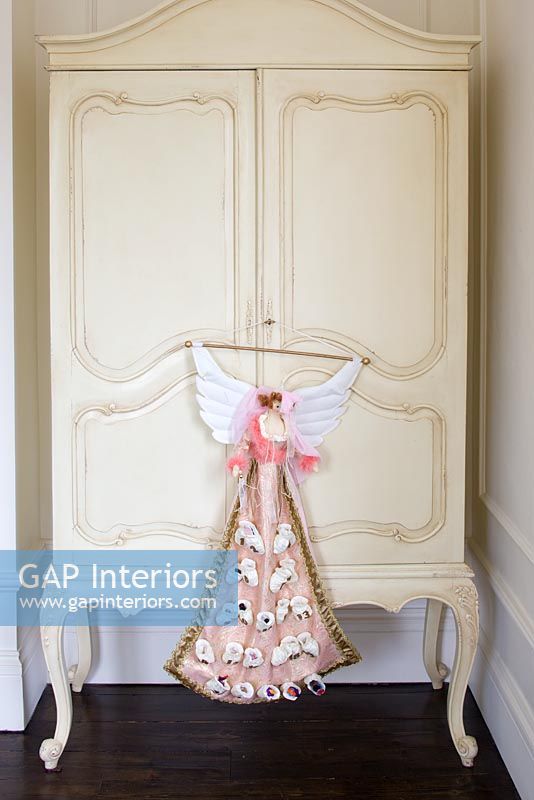 Cream armoire with Christmas advent angel