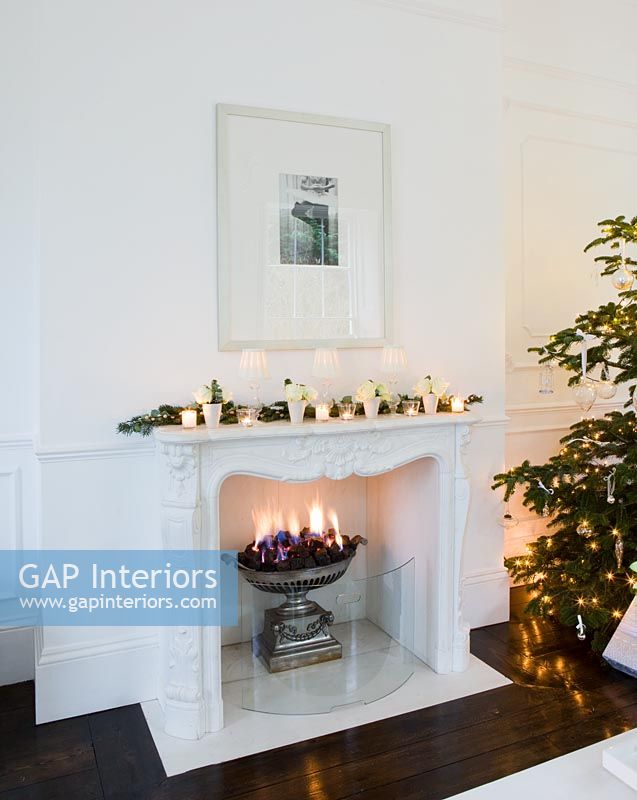 Decorative marble fireplace decorated for christmas

