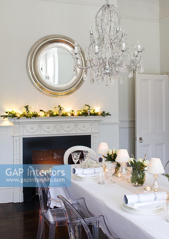 White dining room decorated for christmas meal
