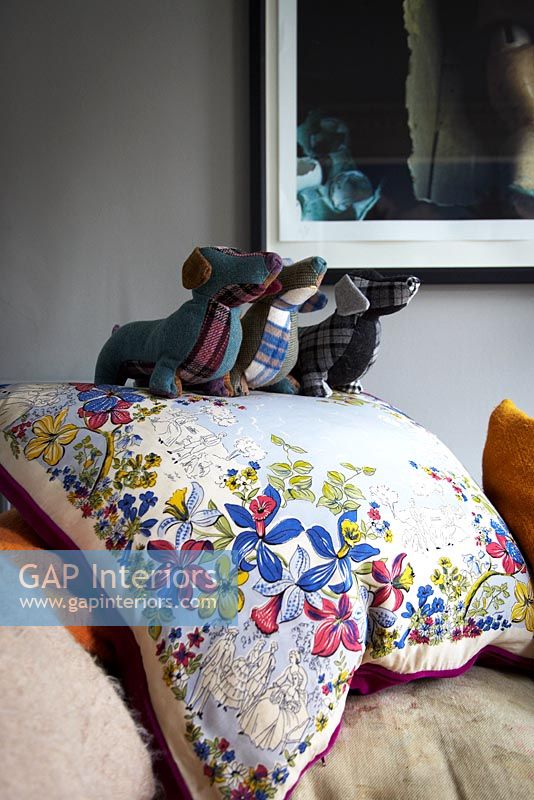 Floral cushion and stuffed toys