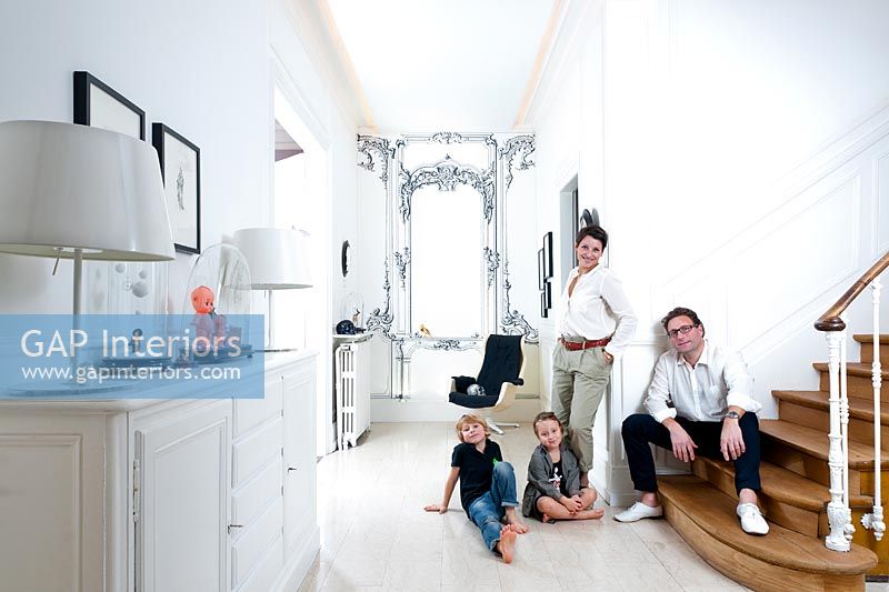 Sandrine and Herve and family in their hallway