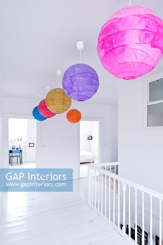 Contemporary landing with colourful paper light shades