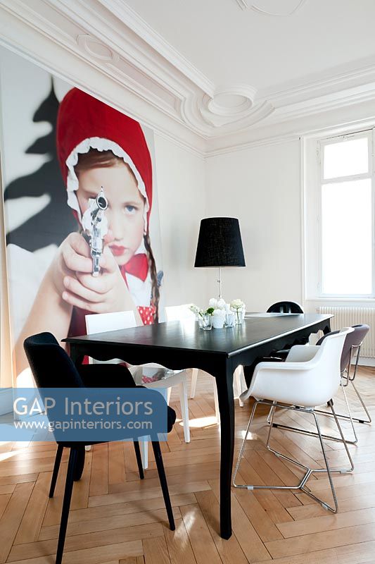 Contemporary dining room with 'Little Red Riding Hood Aiming Revolver' photo by Sandra Seckinger
