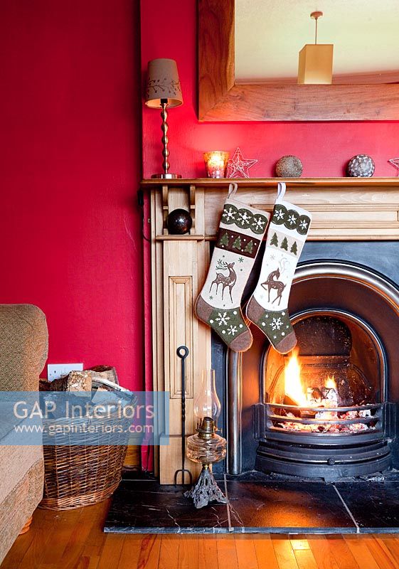 Christmas stockings hanging by fire
