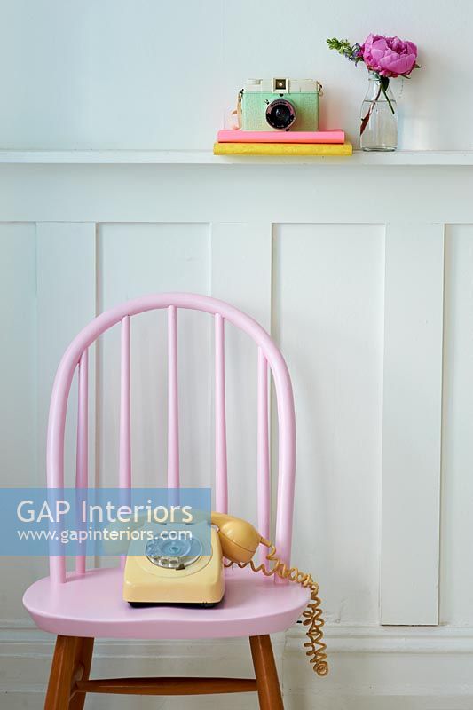 Pastel pink chair and telephone