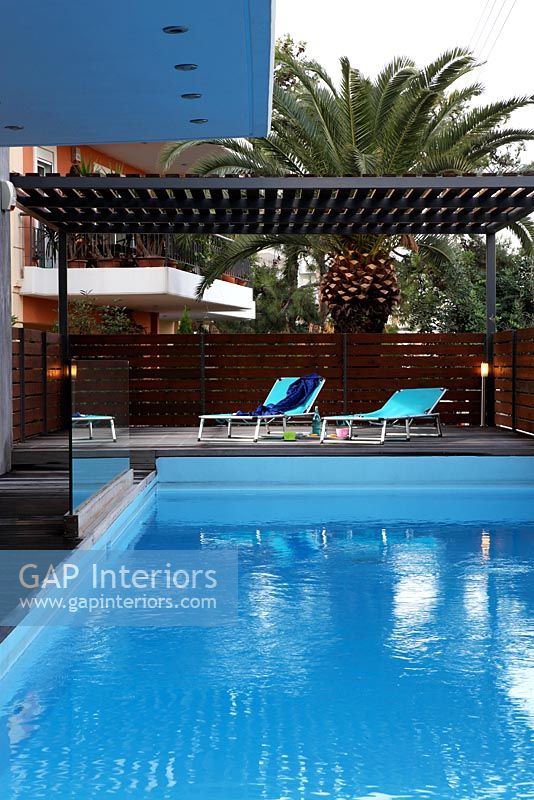 Modern decked patio and pool