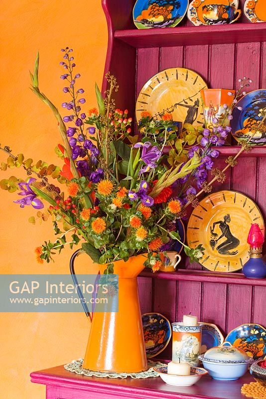 Enamel jug with colourful flowers
