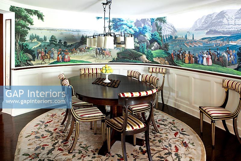 Round dining room with mural