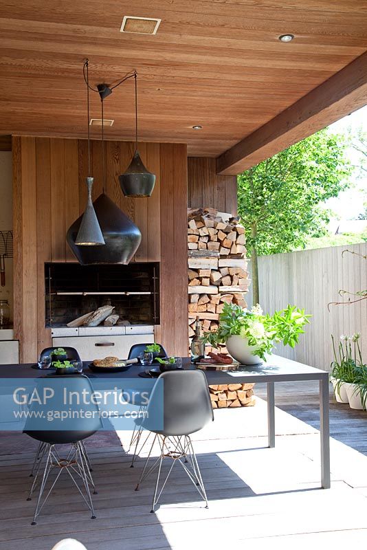 Modern decked patio with fireplace