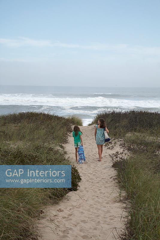 Girls walking towards beach