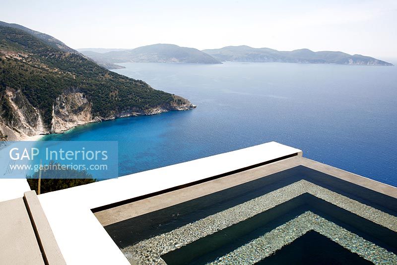 Modern pool overlooking sea