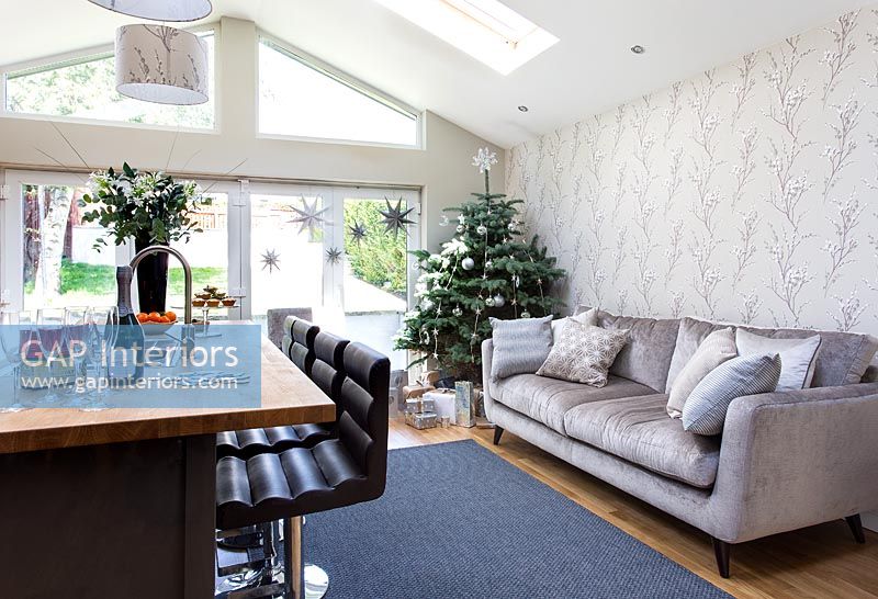 Open plan living room decorated for christmas