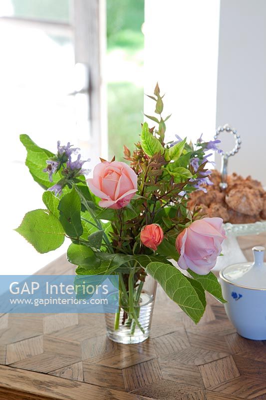 Roses and Catmint in glass vase