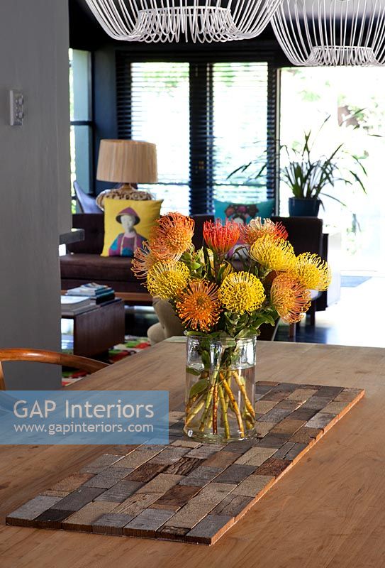Tropical flowers on wooden table