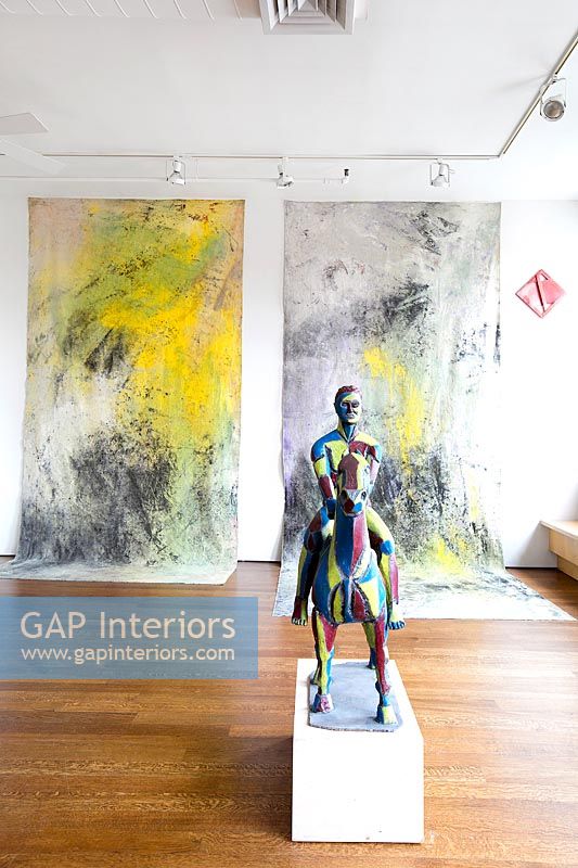 Figurative sculpture and abstract paintings
