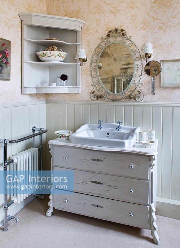Bathroom sink set in vintage chest of drawers
