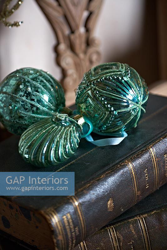 Green baubles and vintage books