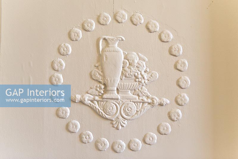 Moulded plaster decoration on wall