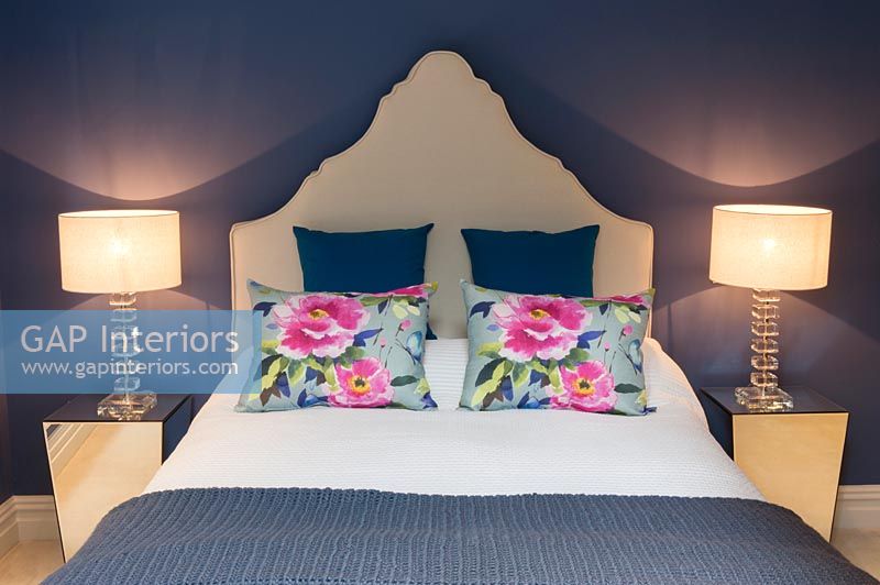 Floral cushions on bed