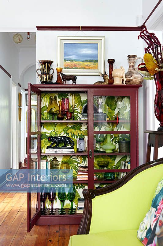 Colourful glassware in display cabinet