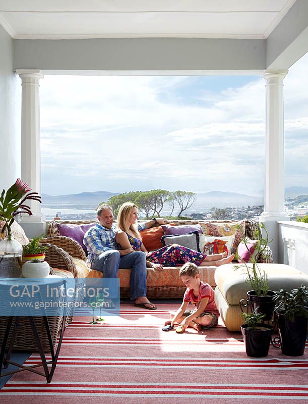 Family relaxing on their veranda