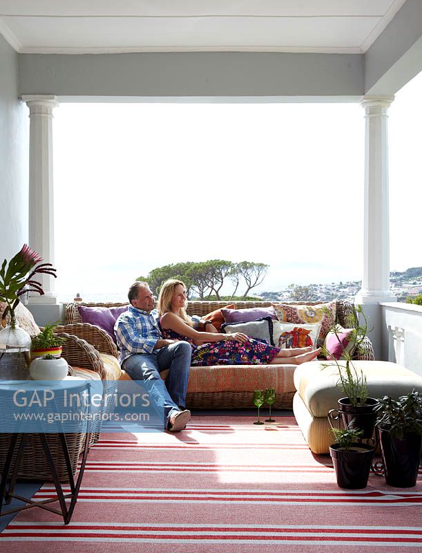 Couple relaxing on their veranda