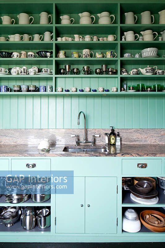 Green kitchen units and shelving