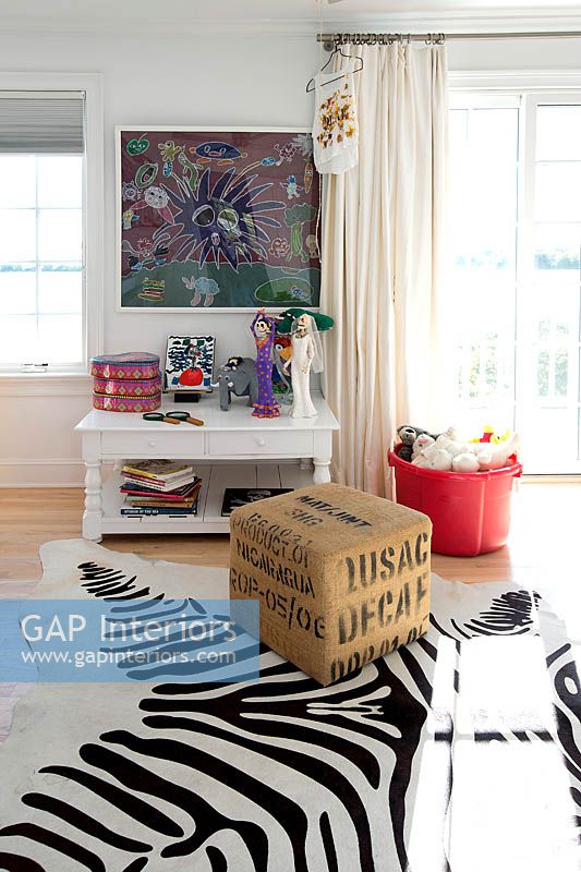 Zebra print rug in childs bedroom