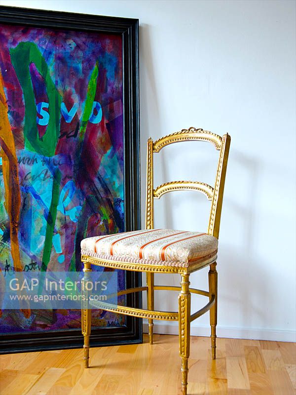 Vintage chair by modern painting