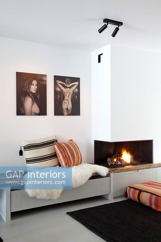 Built in storage and seating by fireplace