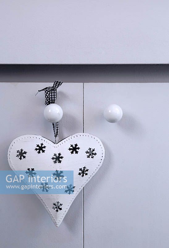 Christmas decoration hanging from bathroom cabinet