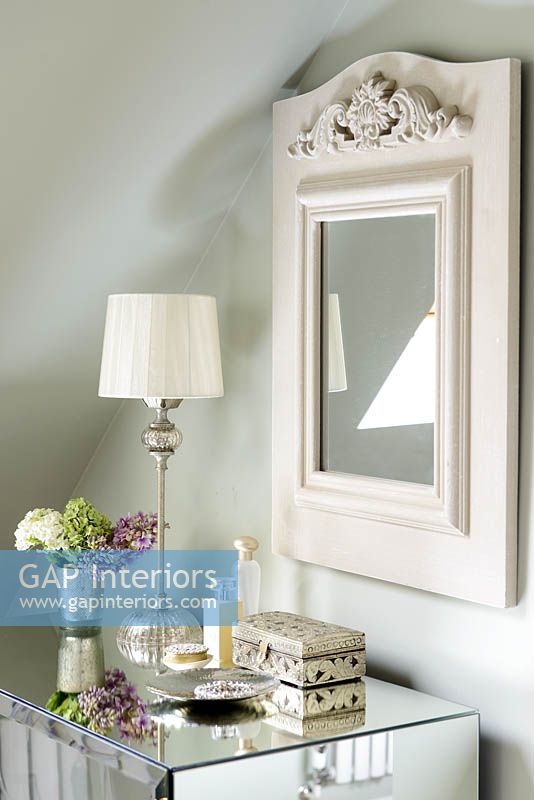 Accessories on mirrored cabinet