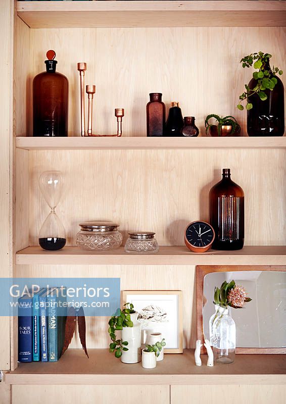 Accessories on wooden shelving
