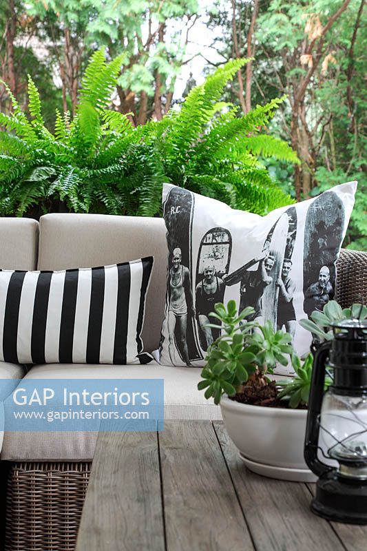 Patterned cushions on garden seat