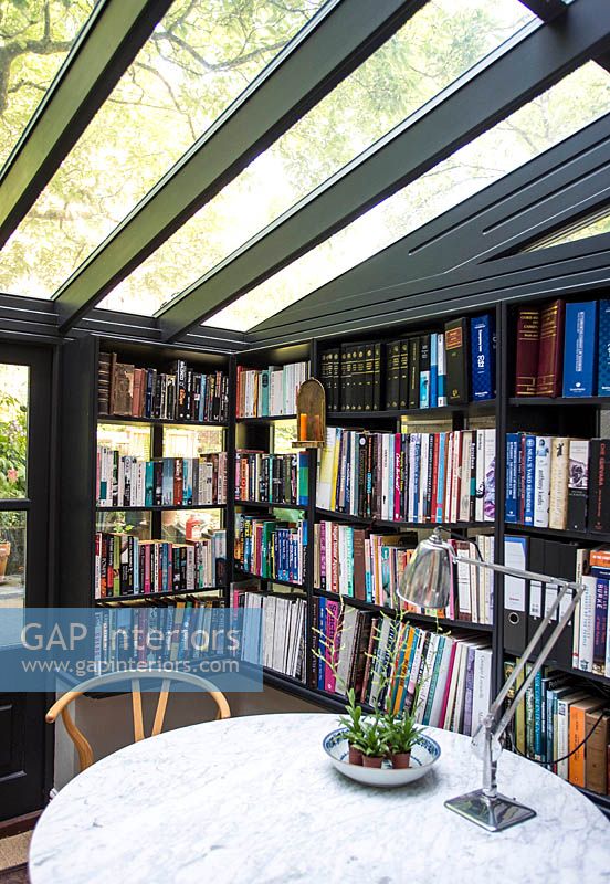 Conservatory with bookshelves