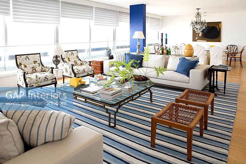Modern open plan seating area with striped rug