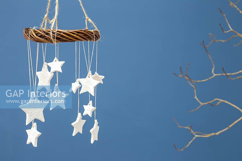 Homemade clay stars with a floral design