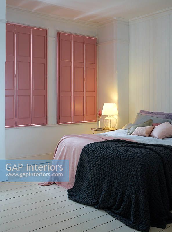 Pink shutters in bedroom