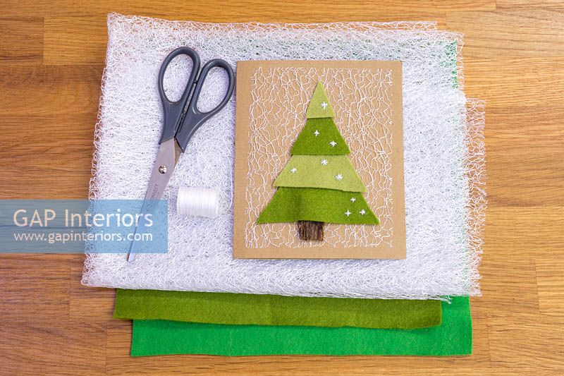 Making felt christmas tree cards - Materials required are a needle, thread, net fabric, coloured felt and a pair of scissors