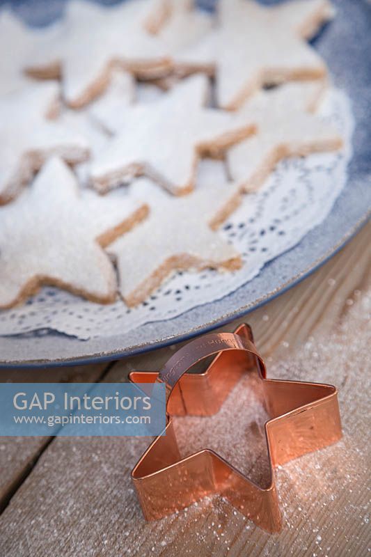 Christmas shortbread stars with a copper star cookie cutter 