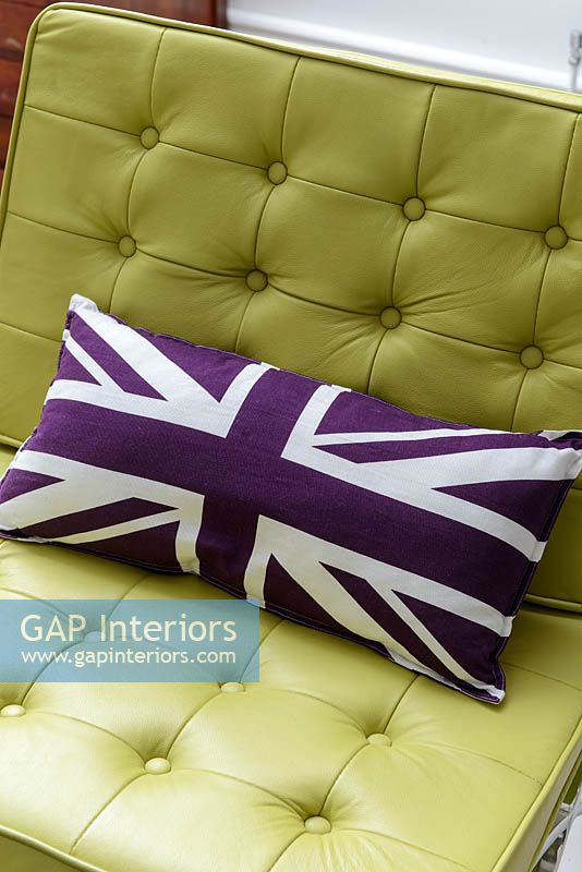 Patterned cushion on leather chair