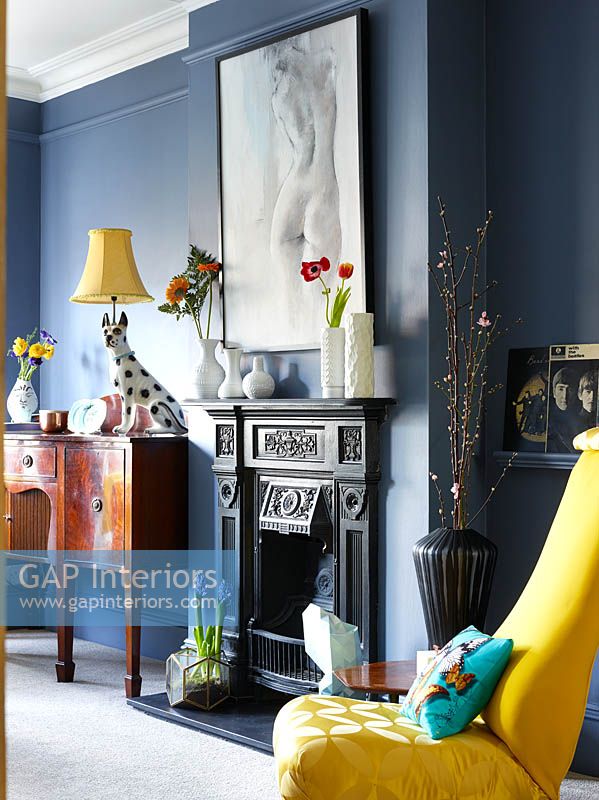 Period fireplace with eclectic accessories