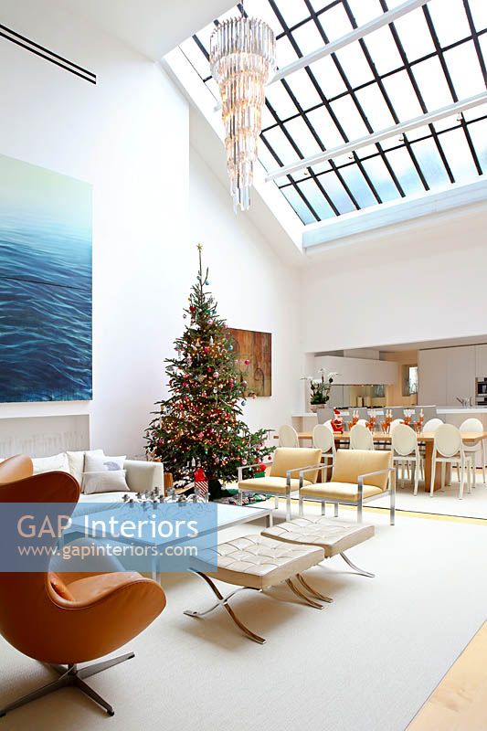 Open plan living space decorated for christmas