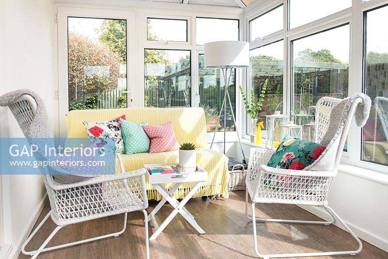 White armchairs in conservatory