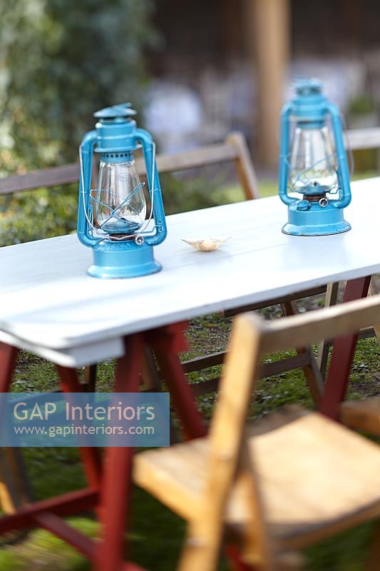 Blue lanterns on garden table