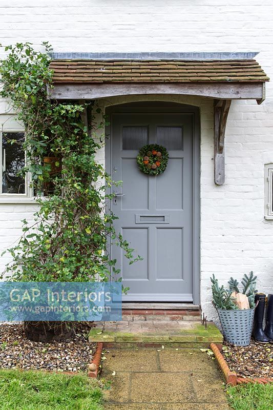 Cottage front door with christmas wreath